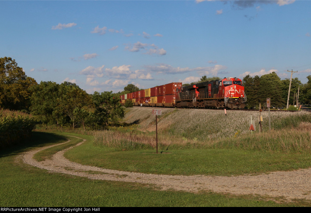 CN 3236 & 3078 lead Z149 west under a beautiful evening sky